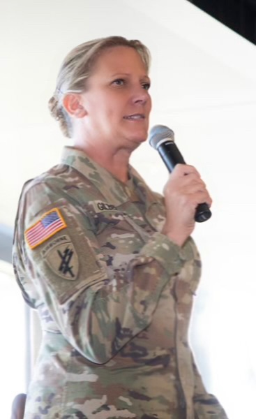 Dr. Beth Gilbertson in Army Uniform speaking at an event