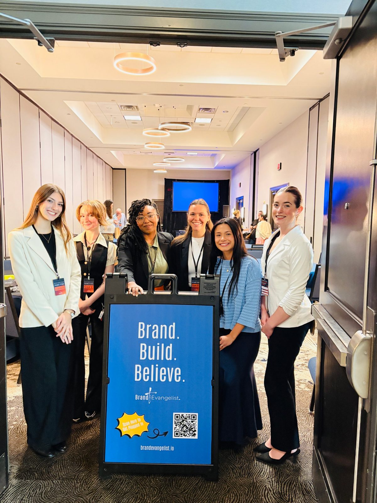 Cortina Jenelle Caldwell with the Brand Evangelist team at the Bridging Innovation conference