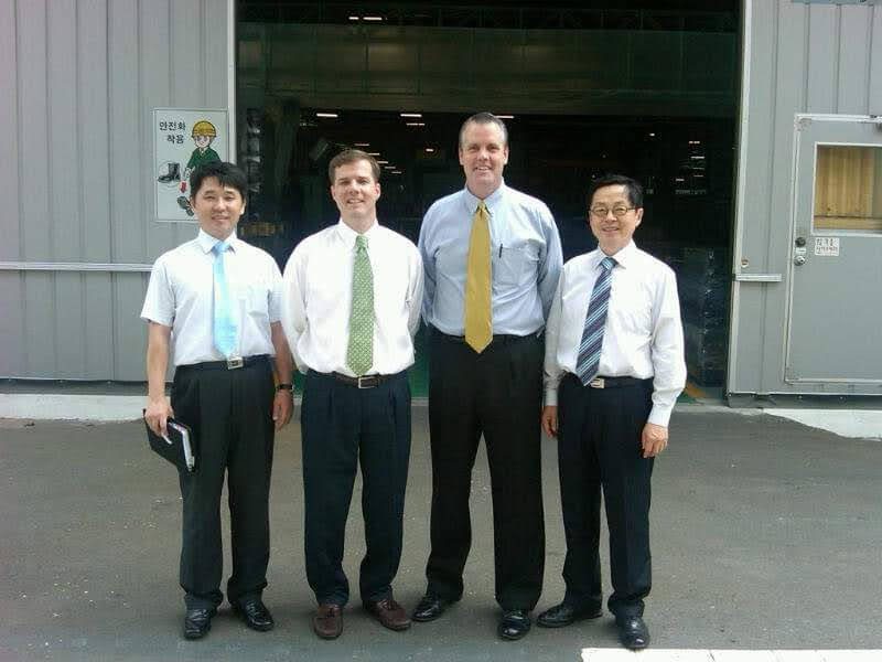 Darryl Heffline with three colleagues outside an industrial facility in Korea