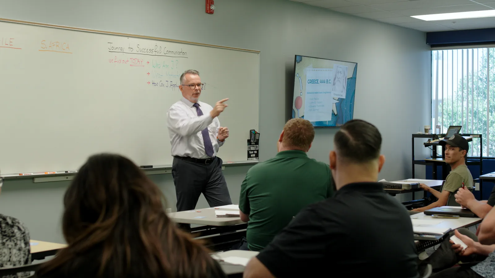 Volker Jaeckel leading a communication workshop at a whiteboard